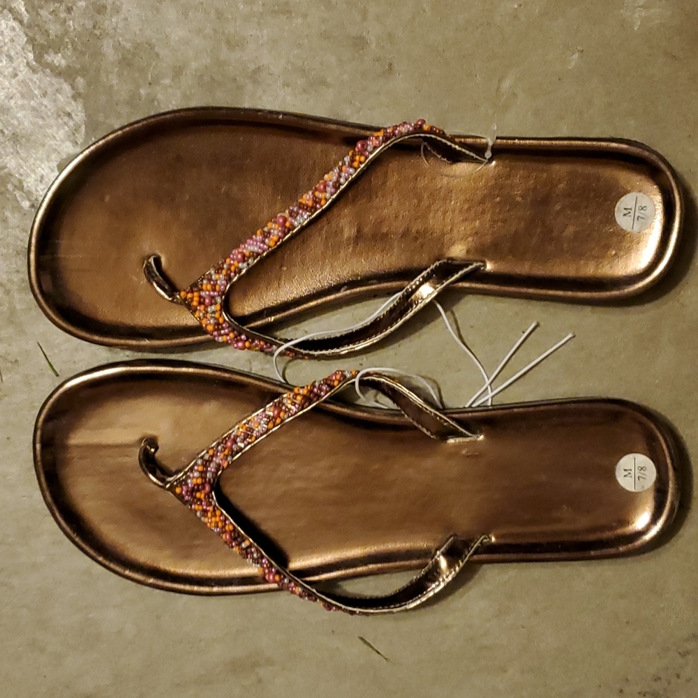 Flip flop size 7 to 8 ,bronze color with beaded strap - brand new